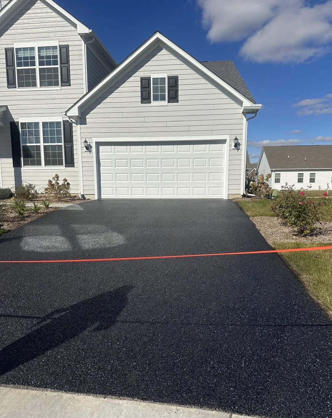 Finished driveway at a two-story home