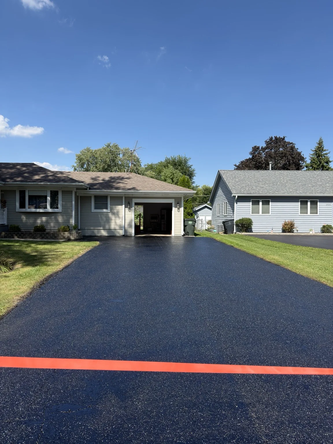 Wide freshly sealed residential driveway